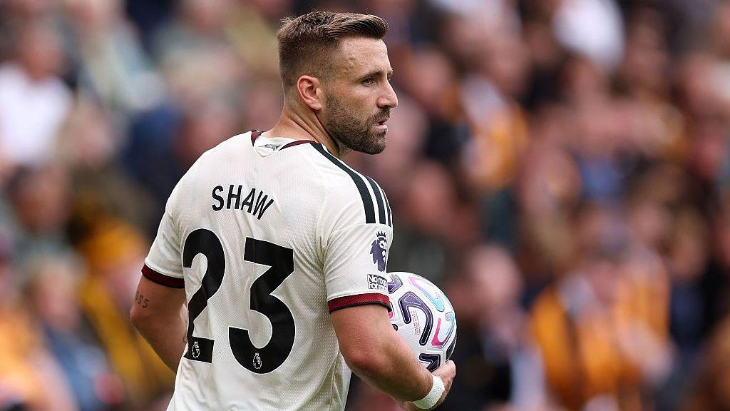 Manchester United full-back Luke Shaw prepares to take a throw in during their Premier League defeat by Hull