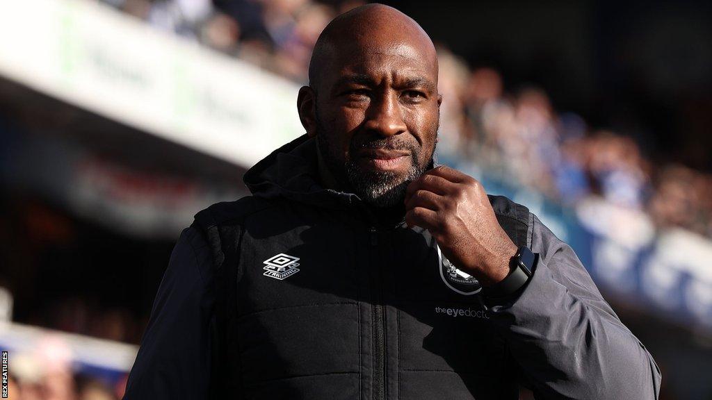 Darren Moore in the dugout during his time managing Huddersfield Town