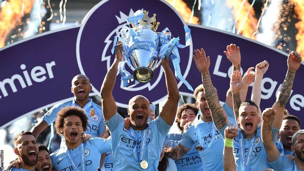 Vincent Kompany lifts the Premier League trophy