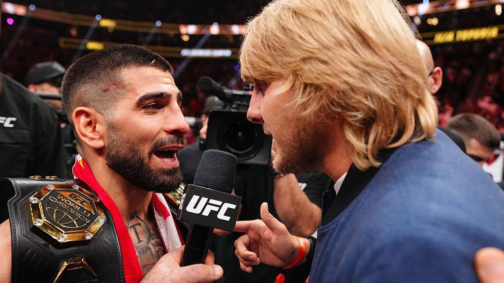 Ilia Topuria and Paddy Pimblett square up in the octagon