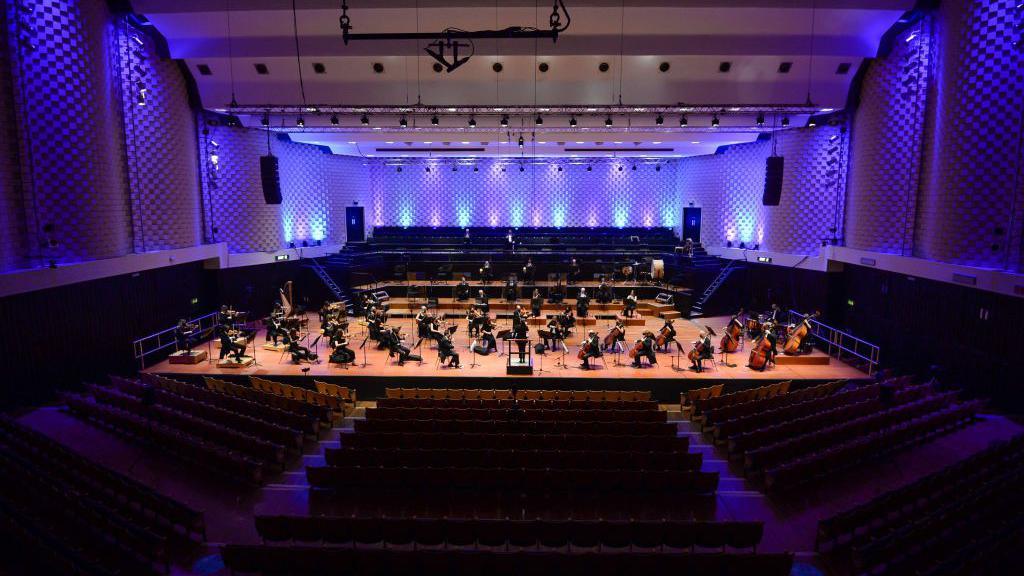 Bournemouth Symphony Orchestra on stage at the Lighthouse Poole, rehearsing in an empty theatre