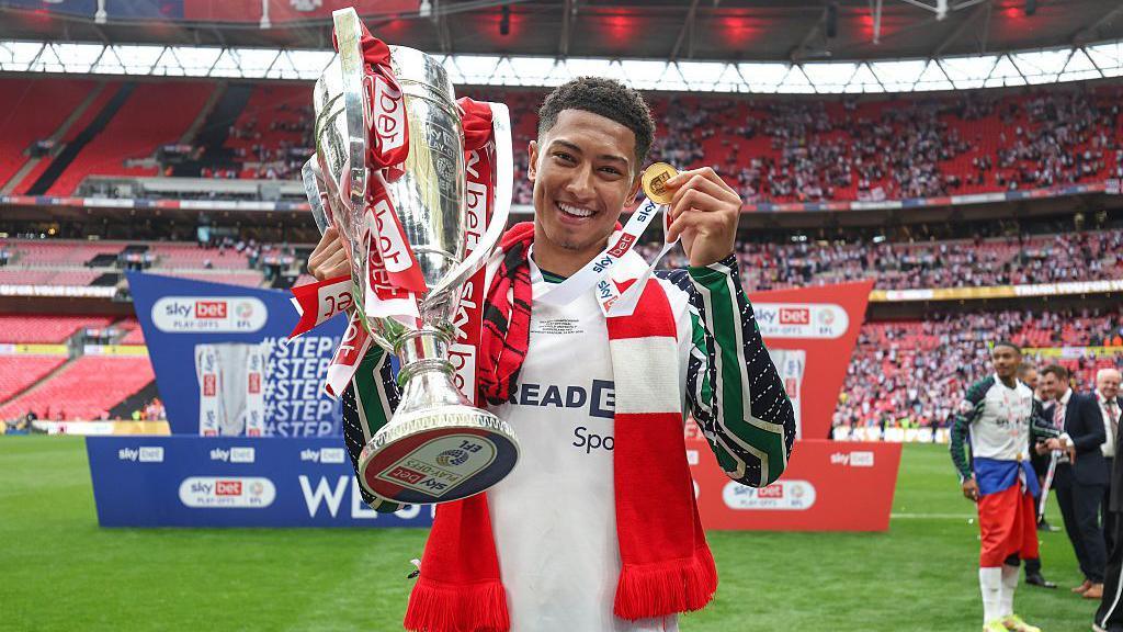 Jobe Bellingham with the trophy and his winners medal after beating Sheffield United in the Championship play-off final.