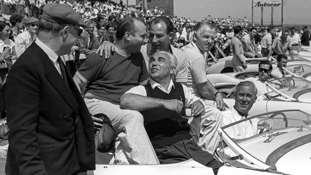 Juan Manuel Fangio, Stirling Moss, Piero Taruffi, Karl Kling, Grand Prix of Great Britain, Aintree Motor Racing Circuit, 16 July 1955. Pre race atmosphere with the Mercedes drivers, with Juan Manuel Fangioi and Stirling Moss like brothers in arms, before the 1955 race at Aintree