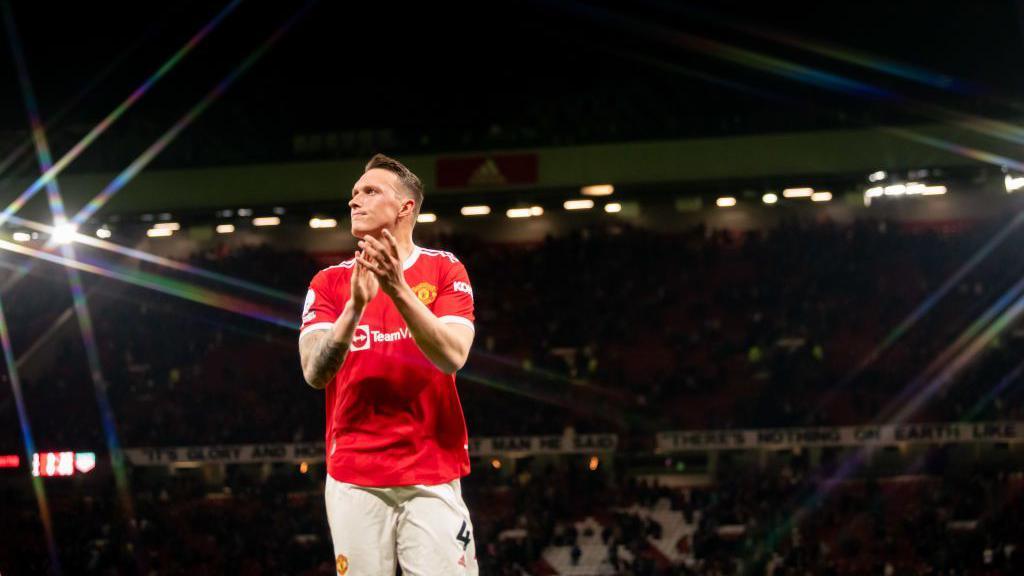 Phil Jones applauds the Old Trafford crowd at the end of his penultimate Manchester United appearance, against Chelsea in April 2022. He made the last of his 229 appearances for the club four days later, as a substitute against Brentford