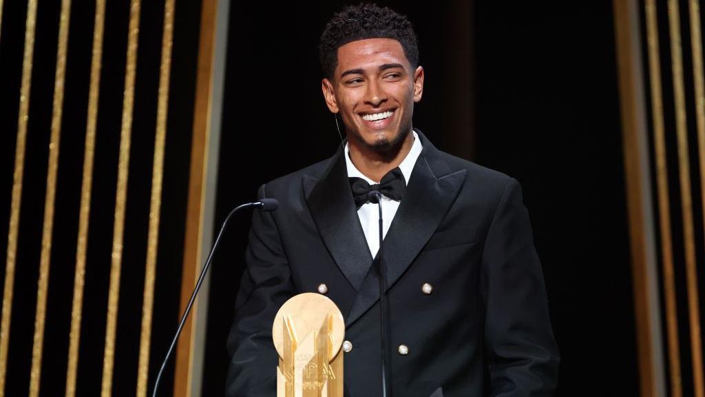 Jude Bellingham collects his third-place award at the Ballon d'Or ceremony