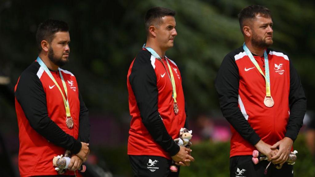 Ross Owen (centre) Owain Dando (left) and Jonathan Tomlinson (right) wearing bronze medals