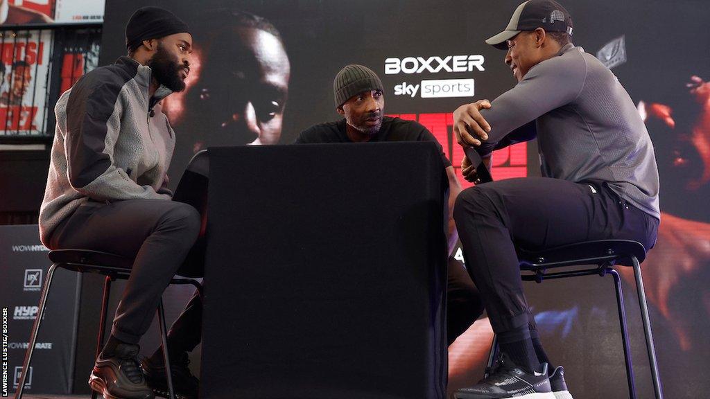 Joshua Buatsi and Dan Azeez sit opposite each other with Johnny Nelson asking the questions