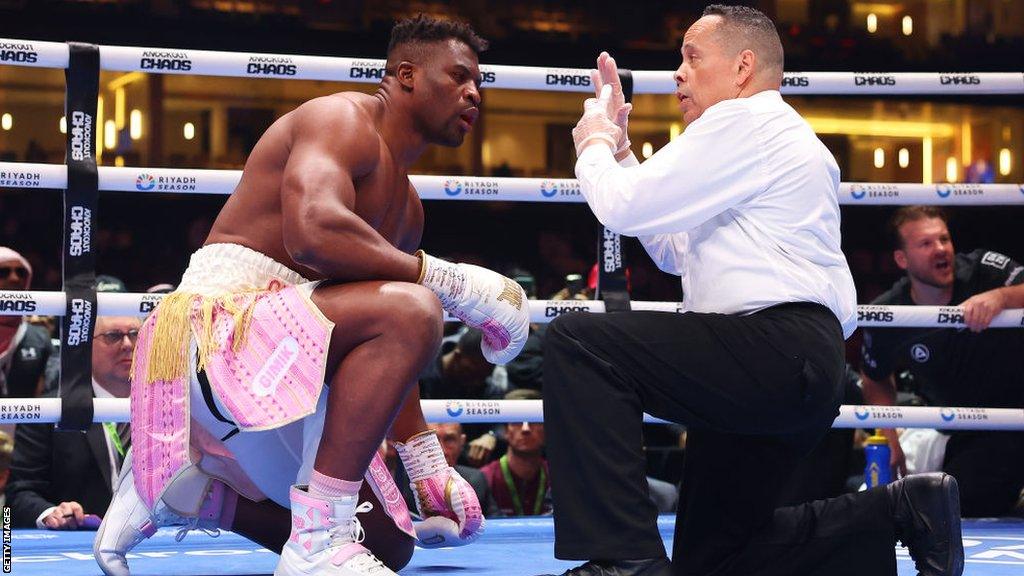 Francis Ngannou is counted by the referee