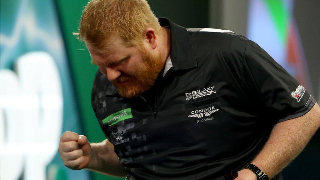 Matt Campbell celebrates beating James Wade at the PDC World Darts Championship