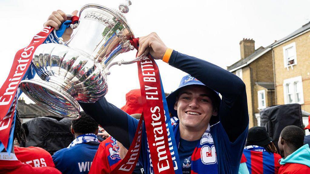 Justin Devenny celebrates with the FA Cup