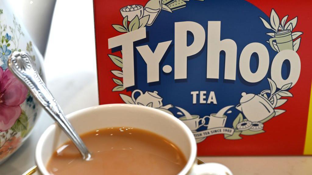 Cup of tea in front of Typhoo Tea box