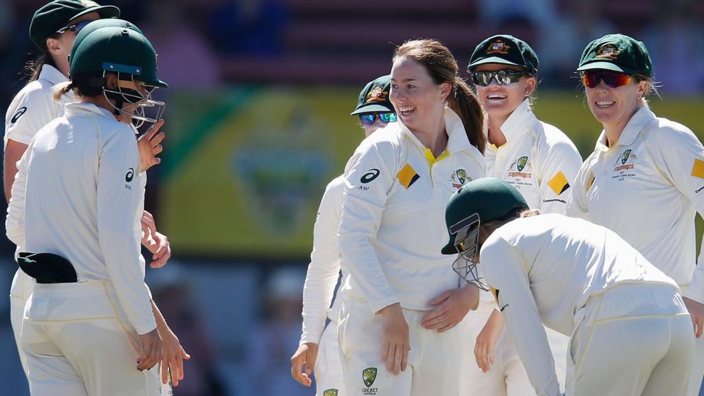 Australia celebrate a wicket by Amanda-Jade Wellington