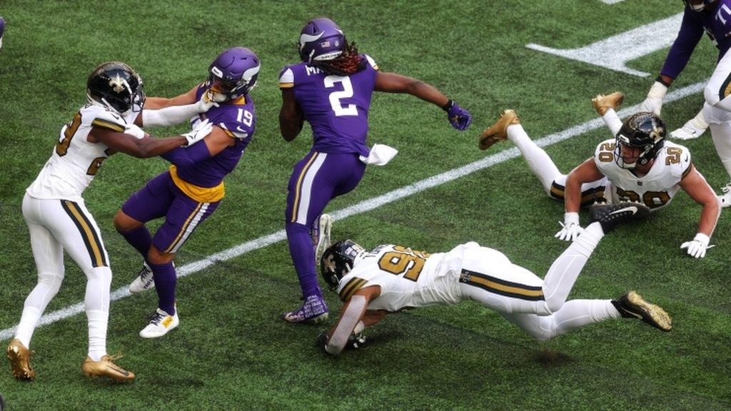 Alexander Mattison runs through to score a touchdown for the Minnesota Vikings