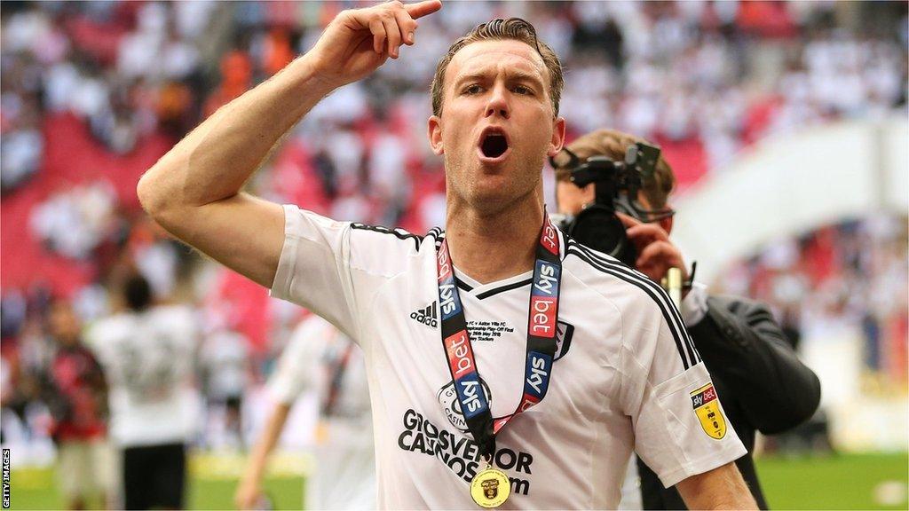 Kevin McDonald celebrates winning promotion to the Premier League with Fulham