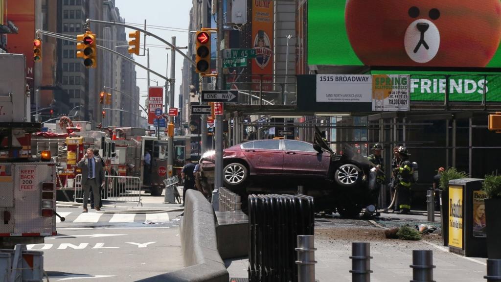 Emergency workers work at the scene after multiple people were injured when a vehicle struck numerous pedestrians in Times Square in New York City, New York, USA, 18 May 2017.