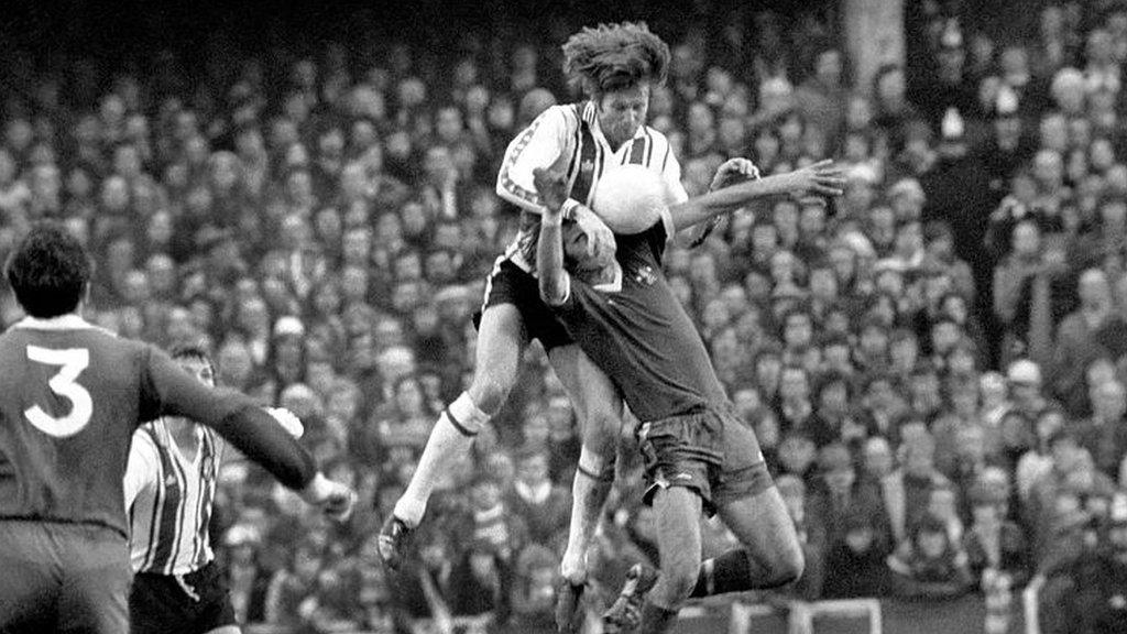 Mel Blyth rises to win a header for Southampton in the FA Cup