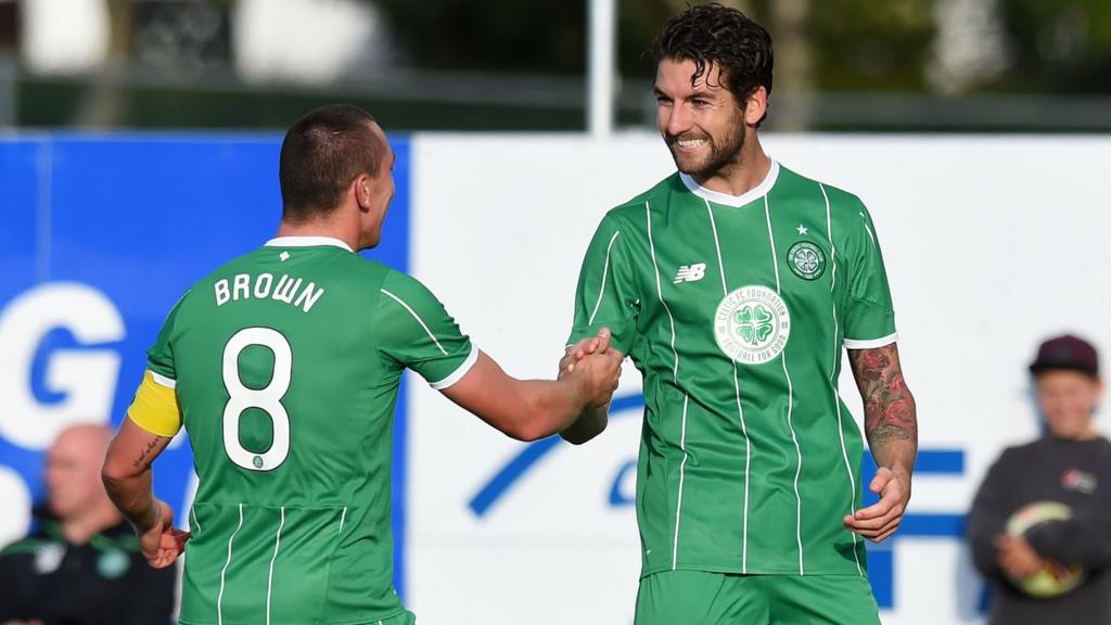 Celtic players Scott Brown and Charlie Mulgrew celebrating