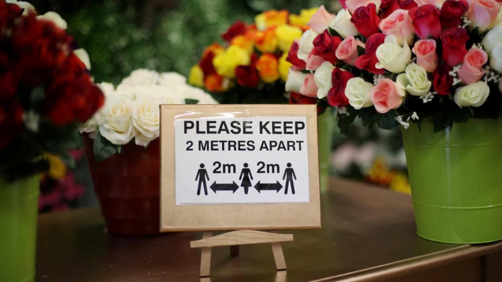 Social distancing sign in a florist