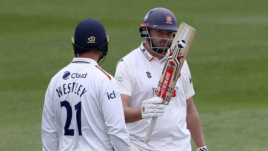 Essex batter Nick Browne (right) raises his bat after reaching 50