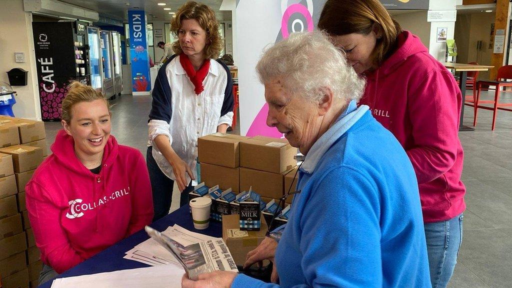 A resident collecting a hamper last year