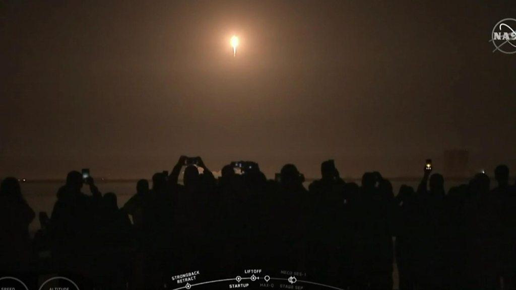 Crowds watching SpaceX take off.