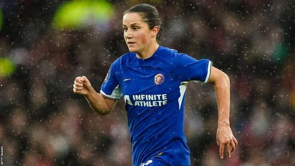 Jessie Fleming is running with the ball in a Chelsea match