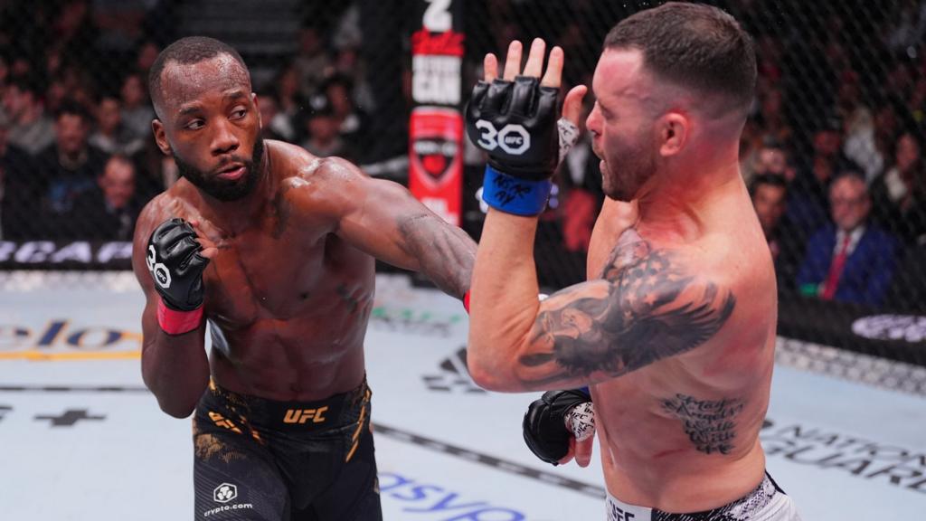 Leon Edwards punches Colby Covington