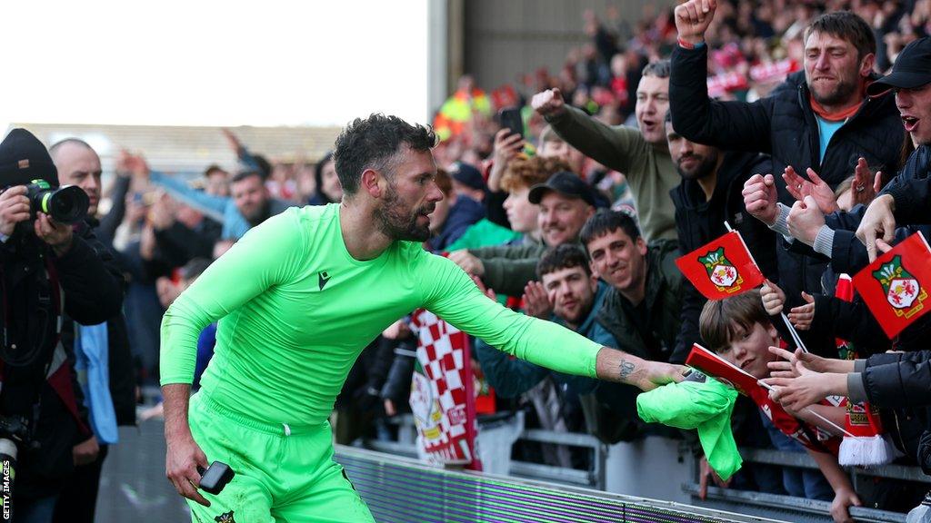 Ben Foster gives his shirt to a Wrexham fan