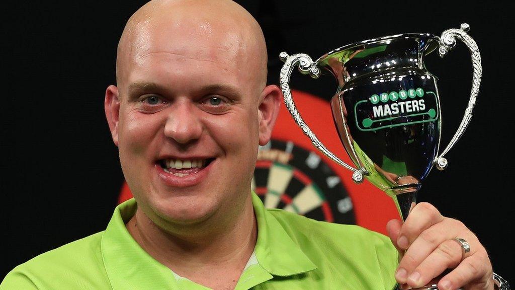 Michael van Gerwen holds the Masters trophy