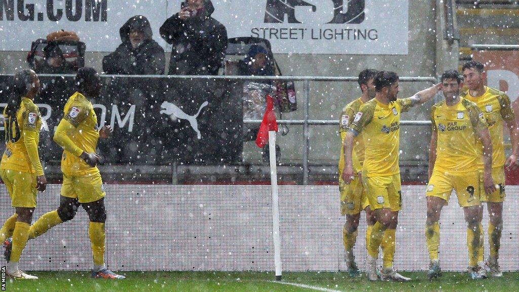 Preston celebrate Ched Evans' goal at Rotherham in the snow