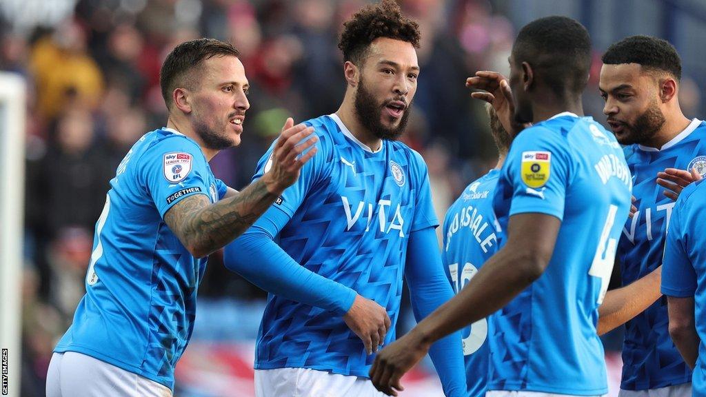 Stockport players celebrate a goal