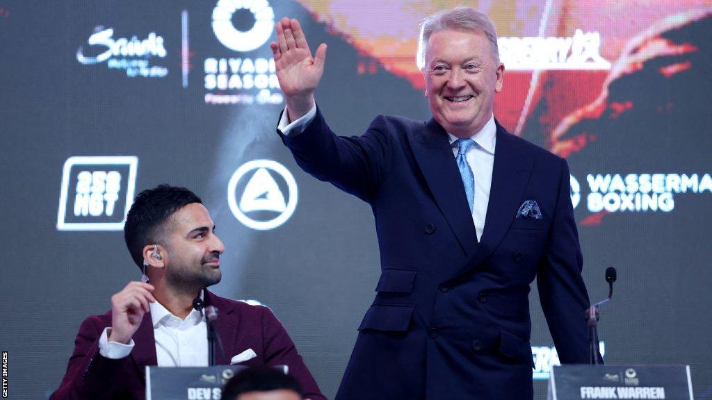 Frank Warren waves to the crowd