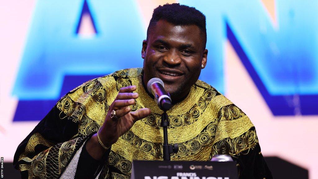 Francis Ngannou speaks during a news conference