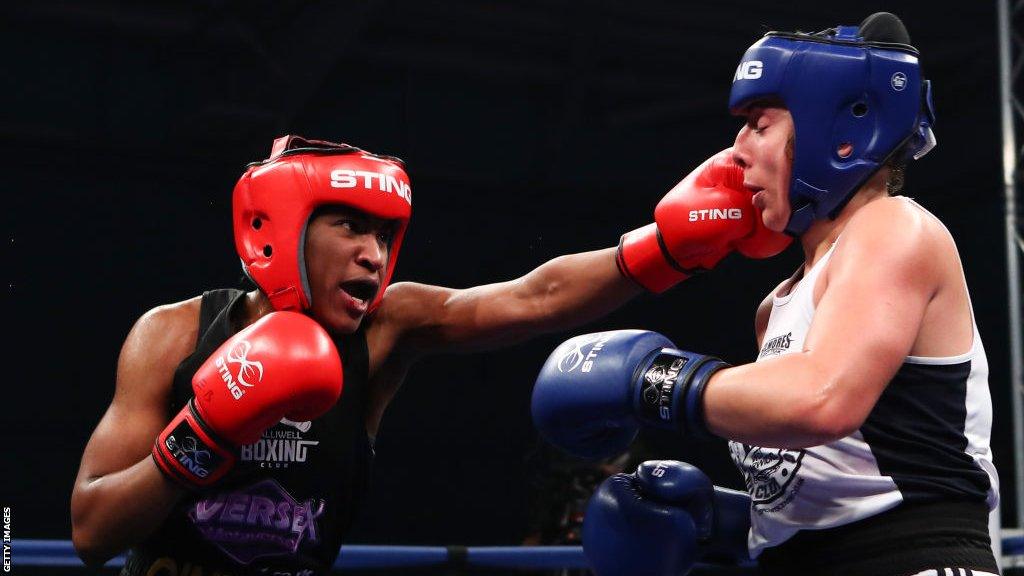 Cindy Ngamba (left) throws a punch at Jerry-Lee Palmer (right)