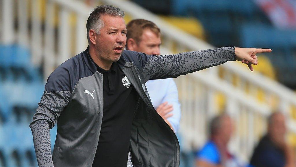 Peterborough United manager Darren Ferguson directs his players from the touchline during a game