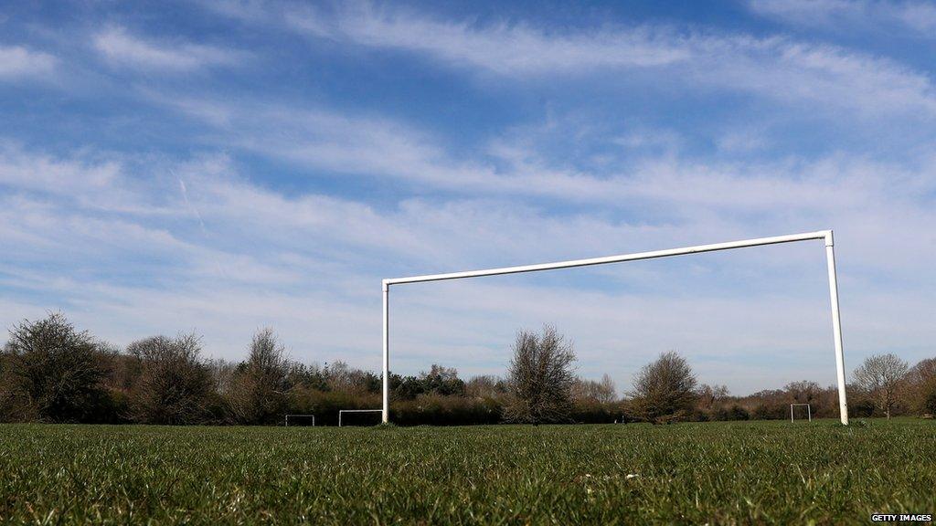 A general view of a field with football goalposts