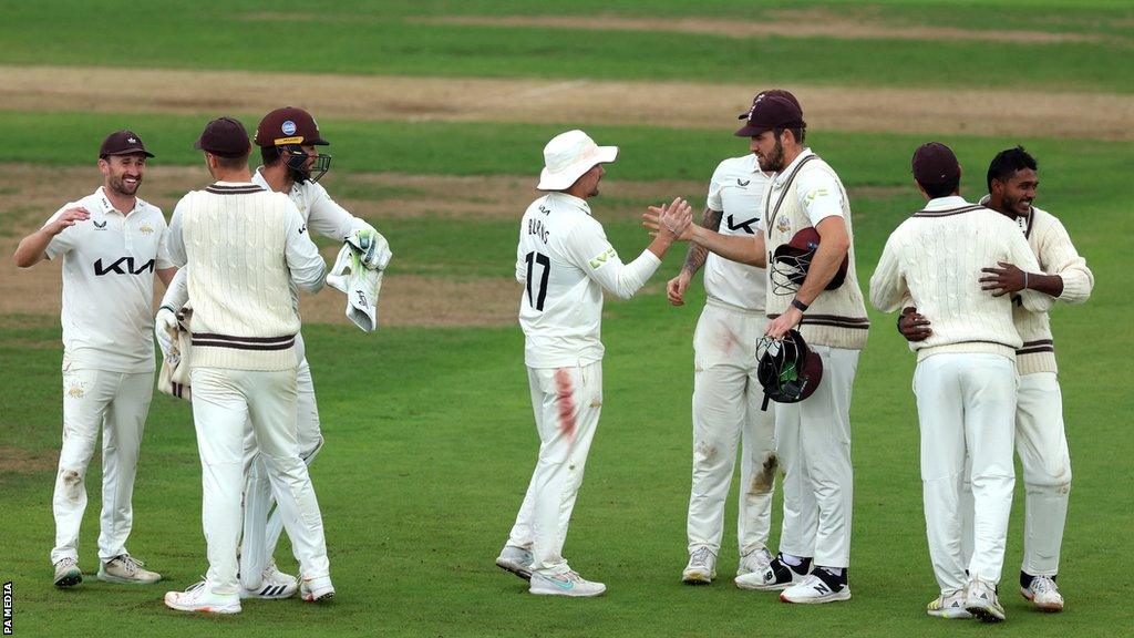 Surrey players celebrate