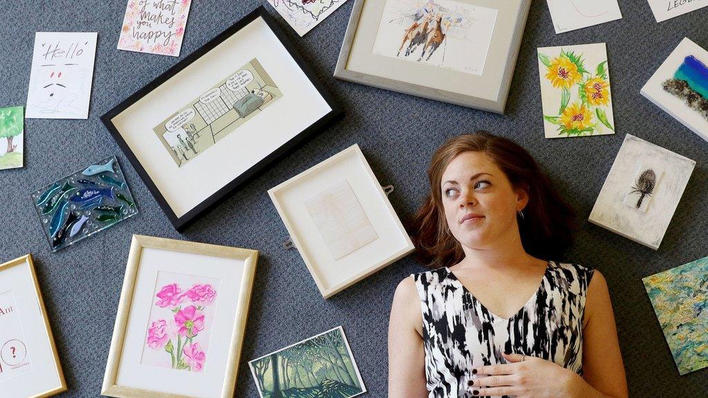 Hattie Allsop with some of the artwork donated by famous artists