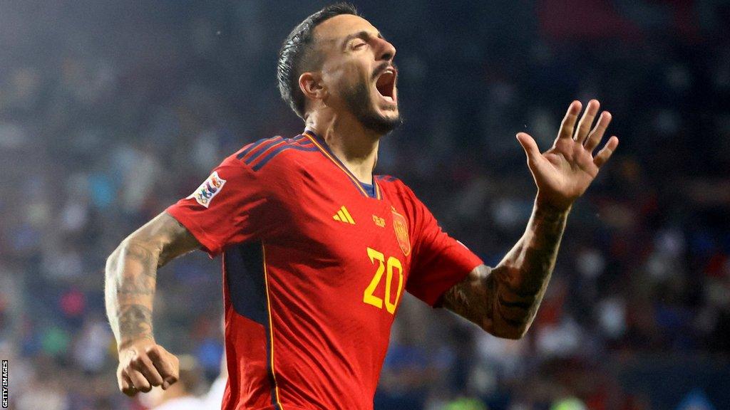 Joselu celebrates his winner for Spain