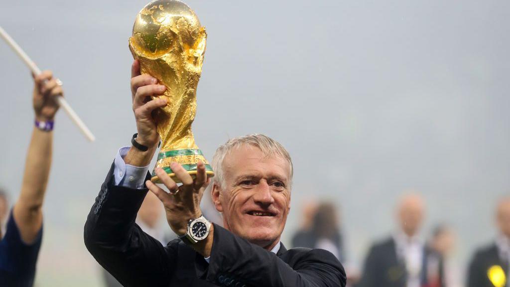 Didier Deschamps lifting the World Cup in 2018