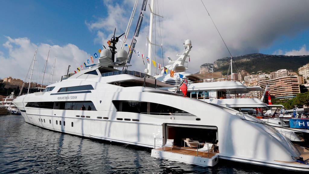 A picture taken on September 25, 2013 shows "Galactica Star" a large white yacht moored at Port Hercules in Monaco. 