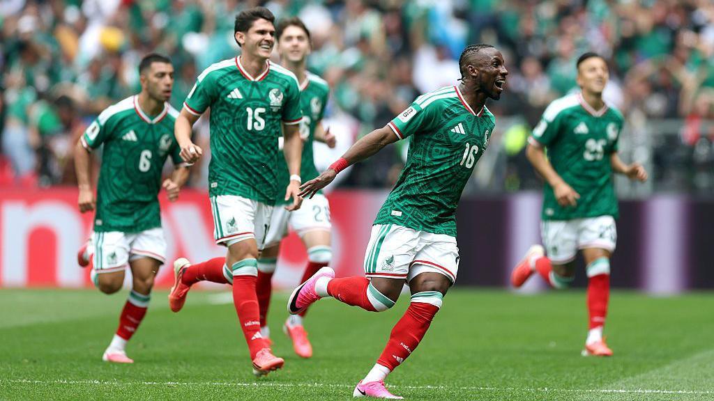 Mexico's Julian Quinones celebrating with teammates after scoring against South Africa.