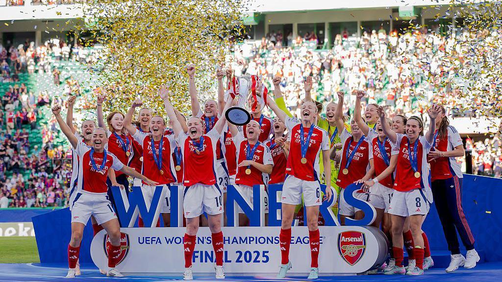 Arsenal lifting the Women's Champions League trophy in May 2025.