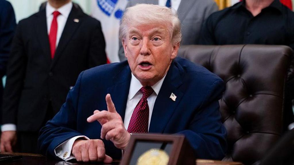 Martin Makary, commissioner of the Food and Drug Administration (FDA), from left, US President Donald Trump, Robert F. Kennedy Jr., US secretary of Health and Human Services (HHS), and media personality Joe Rogan during an executive order signing in the Oval Office.