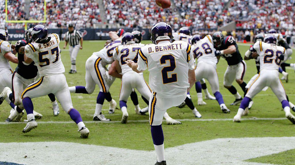 Darren Bennett punts the ball while playing for the Minnesota Vikings