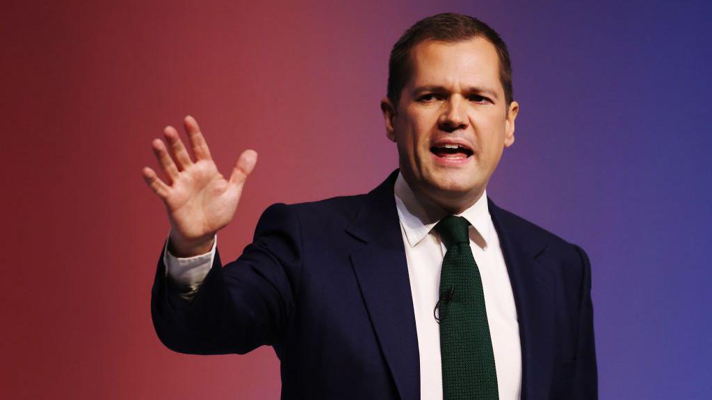 Robert Jenrick delivers his speech on the final day of the Conservative conference in Birmingham