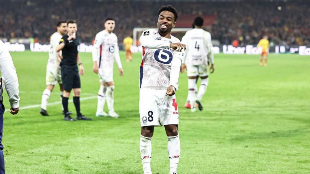 Angel Gomes celebrates in a Lille shirt