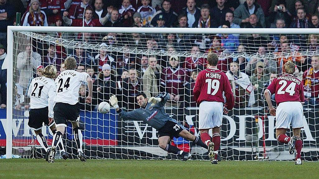 Northampton goal keeper Lee Harper makes an early penalty save from Diego Forlan of Man United during the FA Cup Fourth Round match between Northampton Town and Manchester United at Sixfields Stadium on January 25, 2004