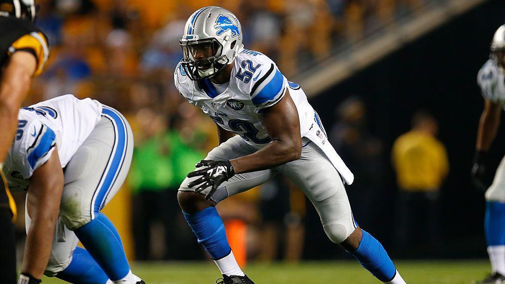 Antwoine Williams in a Detroit Lions uniform about to spring into action during a game