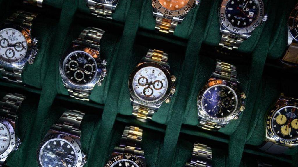 Luxury watch firm to close showrooms and cut jobs
